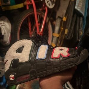 Nike Air Sneakers with Black, Red, and Blue Accents